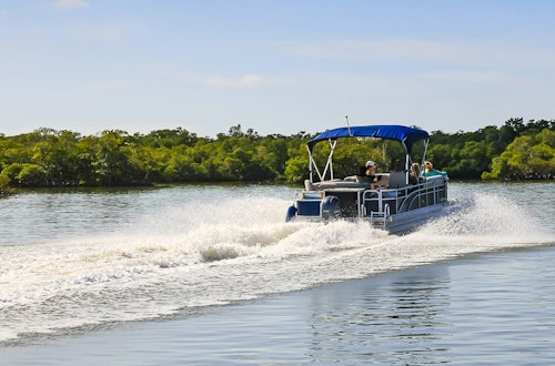 Pontoon with Blue Bimini Top on the Water
